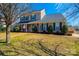 Charming two-story home with green shutters, a manicured lawn, and a welcoming front porch at 102 Brewster Ct, Mooresville, NC 28115