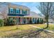 Attractive home featuring green shutters, a tidy lawn, and a charming walkway leading to the entrance at 102 Brewster Ct, Mooresville, NC 28115