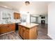 Open kitchen with a butcher block island and access to the living area at 102 Brewster Ct, Mooresville, NC 28115