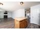 Kitchen island with butcher block countertop and access to the living room at 102 Brewster Ct, Mooresville, NC 28115