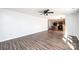 Open-concept layout with laminate flooring, connecting the living area to the kitchen at 102 Brewster Ct, Mooresville, NC 28115