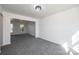 Bright living room featuring neutral walls, gray carpet and a contemporary light fixture at 102 Brewster Ct, Mooresville, NC 28115