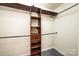 An organized walk-in closet featuring custom shelving and ample storage space at 102 Brewster Ct, Mooresville, NC 28115