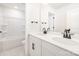 Bright bathroom featuring a double vanity with sleek black fixtures and a tub-shower combo at 149 Saidin Ln, Troutman, NC 28166