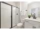 Modern bathroom with glass shower and dual vanity at 149 Saidin Ln, Troutman, NC 28166