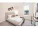 Neutral bedroom with large window, light-colored walls, and decor at 149 Saidin Ln, Troutman, NC 28166