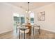 Bright dining nook with a round table, stylish chairs, and sliding glass doors leading to outdoor space at 149 Saidin Ln, Troutman, NC 28166