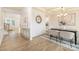 A dining area featuring elegant trim work, a stylish chandelier, and a modern table setting at 149 Saidin Ln, Troutman, NC 28166