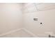 The laundry room includes washer/dryer hookups and a wire shelf for storage at 149 Saidin Ln, Troutman, NC 28166