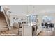 Open-concept living space with fireplace, flowing to kitchen with island seating and a dining area at 149 Saidin Ln, Troutman, NC 28166