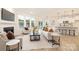 Cozy living room with fireplace and large windows, features an open layout to dining and kitchen at 149 Saidin Ln, Troutman, NC 28166