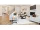 Spacious living room with contemporary furniture, a fireplace, and a staircase leading to the upper level at 149 Saidin Ln, Troutman, NC 28166
