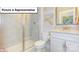 Well-lit bathroom featuring a glass shower, a toilet, vanity with granite counters, and white cabinets at 153 Saidin Ln, Troutman, NC 28166