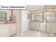 Well-lit bathroom featuring double sinks, granite countertops, and a framed vanity mirror at 153 Saidin Ln, Troutman, NC 28166