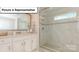 Modern bathroom featuring tiled shower with glass door and granite vanity top at 153 Saidin Ln, Troutman, NC 28166