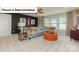 Bonus room offering a comfortable seating area with a sofa and a round upholstered ottoman at 153 Saidin Ln, Troutman, NC 28166