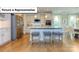 Bright, modern kitchen featuring stainless steel appliances, white cabinets, and a center island with seating at 153 Saidin Ln, Troutman, NC 28166