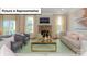 Inviting living room features a stone fireplace, large windows, and comfortable seating arrangements at 153 Saidin Ln, Troutman, NC 28166