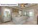 Spacious main bedroom with large windows and a neutral color palette at 153 Saidin Ln, Troutman, NC 28166