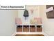 Organized mudroom with a built-in bench, storage cubbies, and hooks for convenient entryway storage at 153 Saidin Ln, Troutman, NC 28166