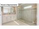 Elegant bathroom featuring tiled glass shower and vanity with marble countertop at 157 Saidin Ln, Troutman, NC 28166