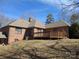 A large, private backyard featuring a deck and brick exterior at 167 Patterson Rd, Kings Mountain, NC 28086