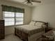 Cozy bedroom with neutral carpet, ceiling fan, and ample natural light at 167 Patterson Rd, Kings Mountain, NC 28086