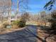 Long paved driveway leading to a beautiful property surrounded by mature trees at 167 Patterson Rd, Kings Mountain, NC 28086
