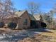 Well-maintained brick home with a paved driveway and mature landscaping at 167 Patterson Rd, Kings Mountain, NC 28086