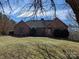 Charming brick home featuring a well-maintained lawn and mature trees at 167 Patterson Rd, Kings Mountain, NC 28086