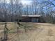 Exterior view of large outbuilding with a garage door and ample storage at 167 Patterson Rd, Kings Mountain, NC 28086