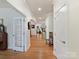 Inviting hallway with hardwood floors and elegant doorway details at 1819 Tranquility Blvd, Lancaster, SC 29720