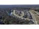 Neighborhood aerial view showcasing a community of homes, ponds, and mature trees at 234 Pintail Dr, Monroe, NC 28110