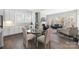 Open concept dining room with kitchen view and seamless connection to the living room at 234 Pintail Dr, Monroe, NC 28110
