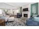 Inviting living room with a fireplace and open view to the kitchen, creating a welcoming space at 234 Pintail Dr, Monroe, NC 28110