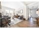Sun-filled living room featuring hardwood floors, elegant furniture, and natural light at 234 Pintail Dr, Monroe, NC 28110
