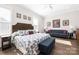 Spacious main bedroom features a sitting area, hardwood floors, and ample natural light at 234 Pintail Dr, Monroe, NC 28110