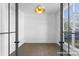 A bright bedroom with hardwood flooring and a modern light fixture at 2530 Elkwood Cir, Charlotte, NC 28205