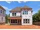 New construction home's back shows Tyvek wrap, windows, and roof at 2530 Elkwood Cir, Charlotte, NC 28205