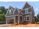 New construction home featuring gray siding, white trim, and an attached garage at 2530 Elkwood Cir, Charlotte, NC 28205