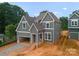 New construction home featuring gray siding, white trim, and an attached garage at 2530 Elkwood Cir, Charlotte, NC 28205