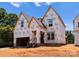 New construction home showing the frame and Tyvek wrap against blue sky at 2530 Elkwood Cir, Charlotte, NC 28205