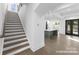 Open concept foyer with view of stairs and kitchen at 2530 Elkwood Cir, Charlotte, NC 28205