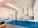 Bright kitchen with white cabinets and an island offers open space for cooking and entertaining at 2530 Elkwood Cir, Charlotte, NC 28205