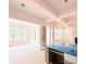 Bright open concept living room with access to the sunroom and a fireplace at 2530 Elkwood Cir, Charlotte, NC 28205