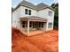 Newly constructed home featuring a covered porch and a walk-out basement at 2530 Elkwood Cir, Charlotte, NC 28205