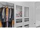 Organized closet space with hanging rods, glass display shelves, and built-in storage at 3008 Dundee Ln, Fort Mill, SC 29707