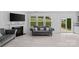 Comfortable living room with a fireplace and a large window overlooking the backyard at 3008 Dundee Ln, Fort Mill, SC 29707