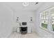 Bright office space with a large window, modern desk, floating shelves, and neutral decor at 3008 Dundee Ln, Fort Mill, SC 29707