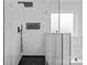 Modern bathroom shower with sleek black hardware, marble-like tile, and frameless glass enclosure at 3008 Dundee Ln, Fort Mill, SC 29707